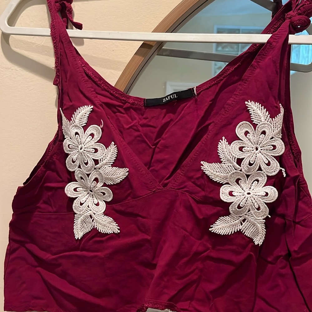 Maroon crop top with white embroidered designs